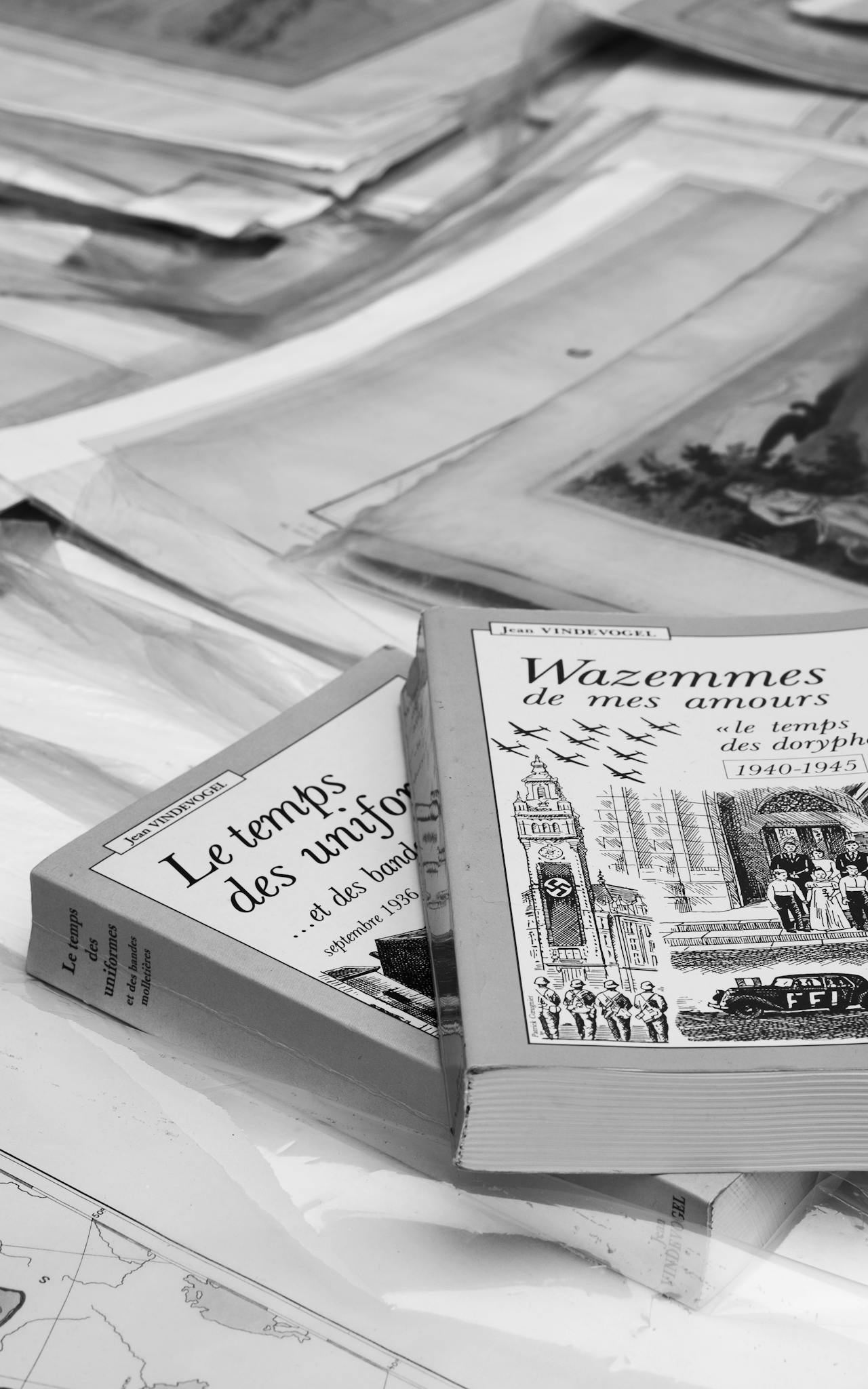 Aesthetic display of vintage books and papers in monochrome